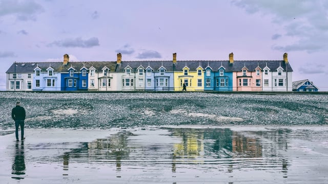 House number numerology - colorful row of homes representing different address vibrations