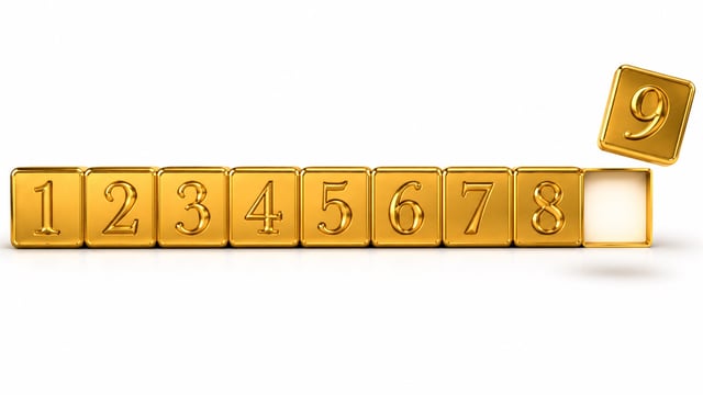 Gold tiles numbered 1 through 9, with the 9 floating apart — representing Chaldean numerology's sacred number